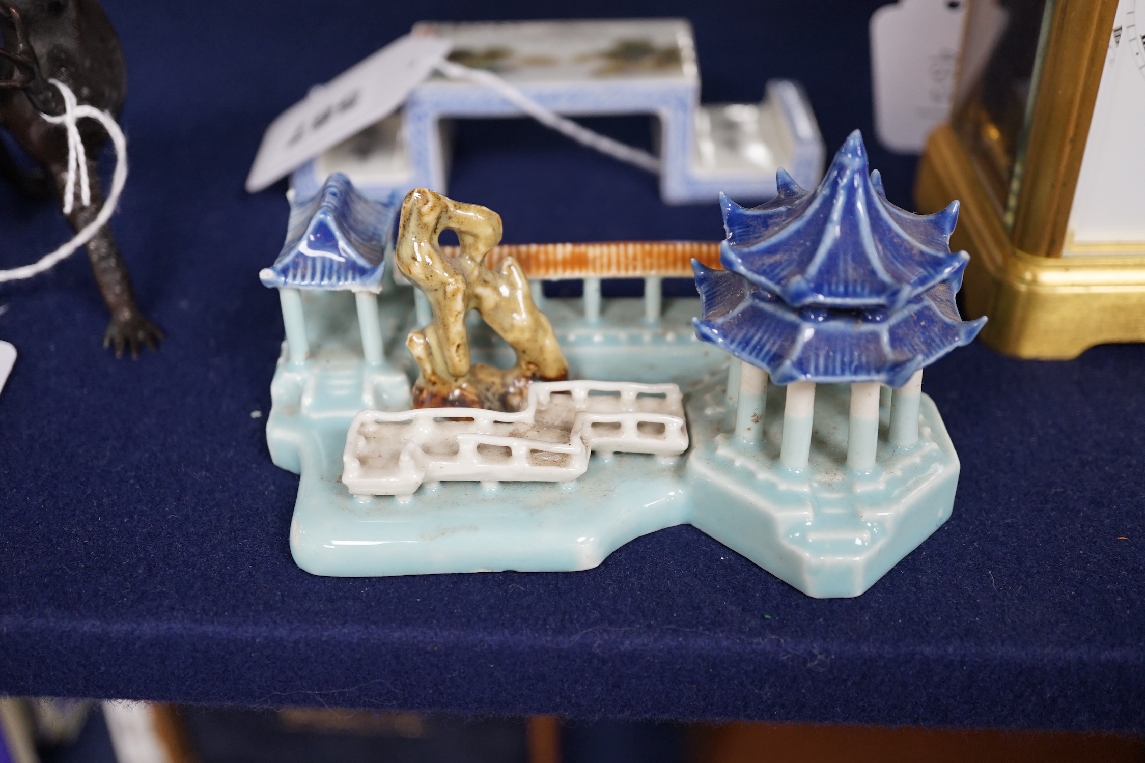 A Chinese model of pavilions and an enamelled porcelain ink stand, 12.5cm